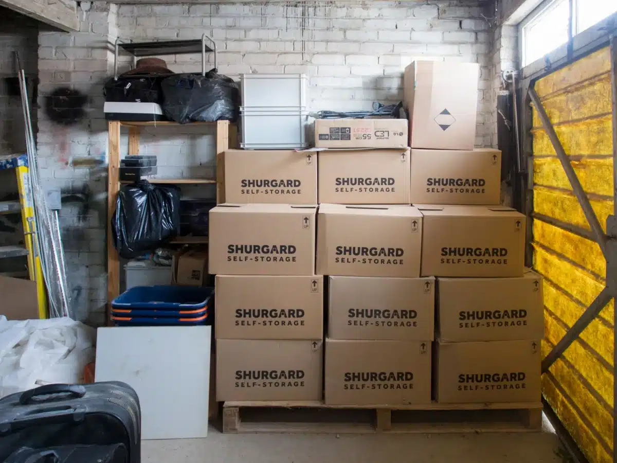 Clear storage bins stacked neatly in an organized garage