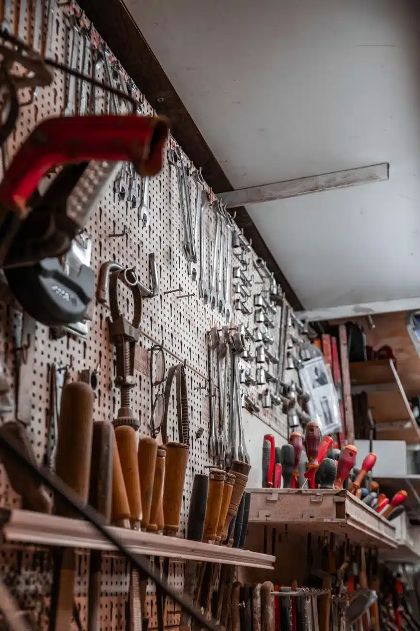 Garage wall with hanging tools organized for easy access