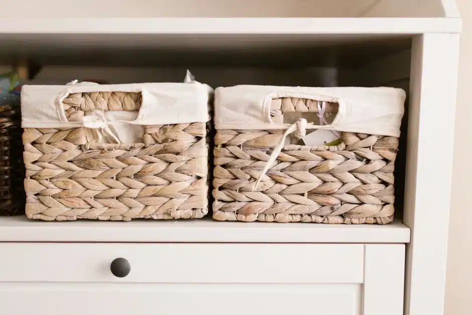 Folded towels stacked in thirds on a linen closet shelf