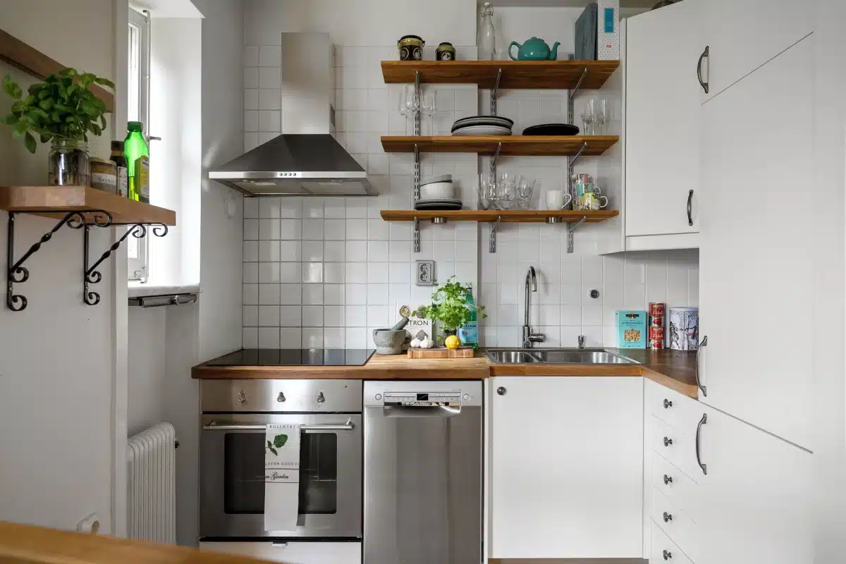 Small apartment kitchen with open shelving and organized counter space