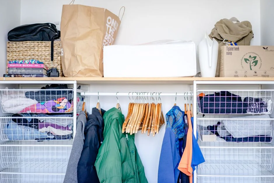Organized closet shelves with labeled bins
